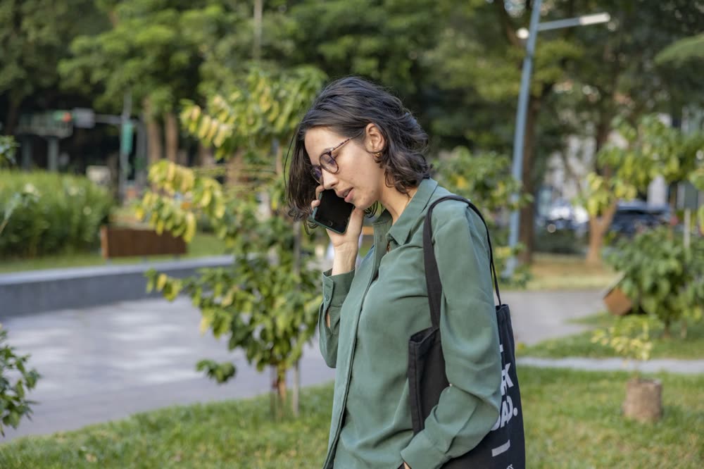A customer on the phone outdoors