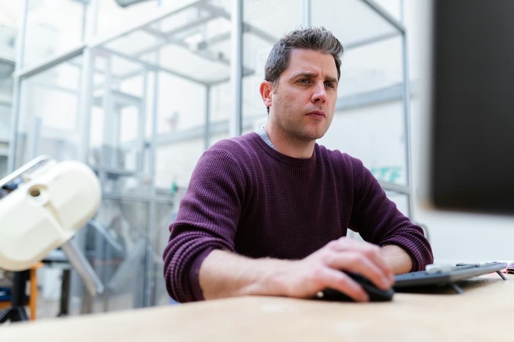 A professional working at his computer